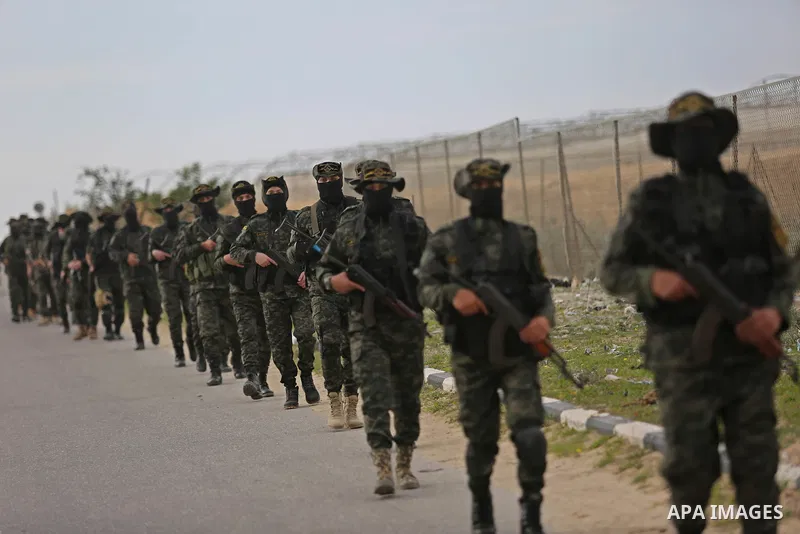 Palestinian Islamic Jihad militants take part in a military show in Khan Younis in the southern Gaza Strip February 15, 2018. Photo by Ashraf Amra