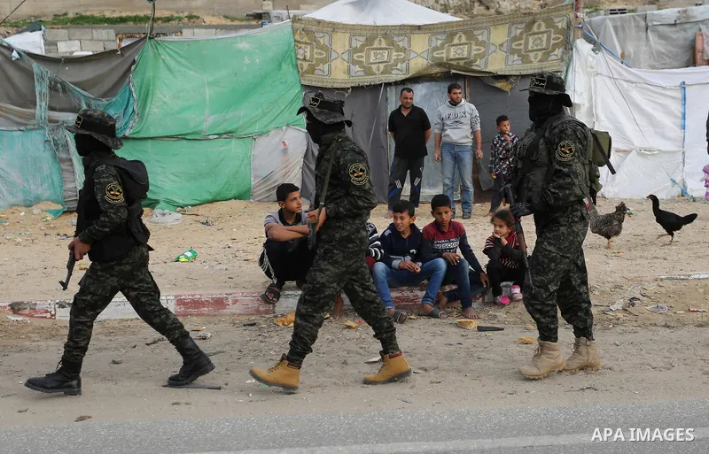 Palestinian Islamic Jihad militants take part in a military show in Khan Younis in the southern Gaza Strip February 15, 2018. Photo by Ashraf Amra