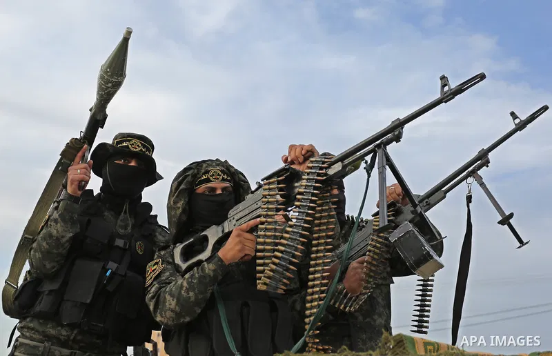 Palestinian Islamic Jihad militants take part in a military show in Khan Younis in the southern Gaza Strip February 15, 2018. Photo by Ashraf Amra