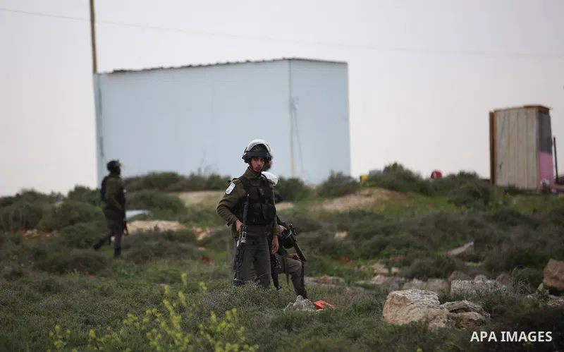 Israeli soldier fires tear gas grenades at Palestinians during clashes at the Beta village near the West Bank city of Nablus, 15 February 2018. According to local sources at least five Palestinian were injured during the...