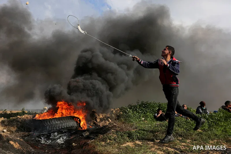 Palestinian protesters clash with Israeli security forces as demonstrations continue over US President Donald Trump's declaration of Jerusalem as Israel's capital near the border with Israel in the southern Gaza Strip Fe...