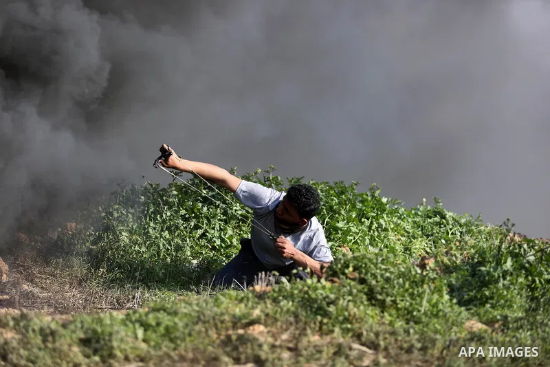 Palestinian protesters clash with Israeli security forces as demonstrations continue over US President Donald Trump's declaration of Jerusalem as Israel's capital near the border with Israel in the southern Gaza Strip Fe...