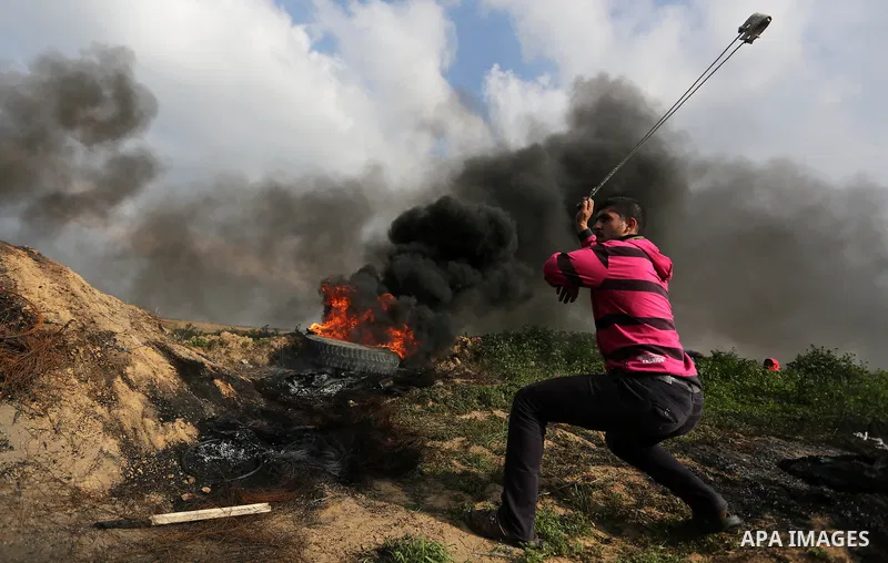 Palestinian protesters clash with Israeli security forces as demonstrations continue over US President Donald Trump's declaration of Jerusalem as Israel's capital near the border with Israel in the southern Gaza Strip Fe...
