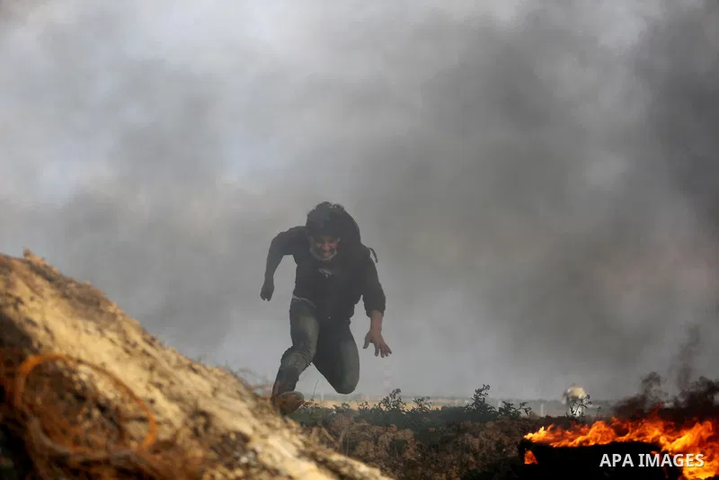 Palestinian protesters clash with Israeli security forces as demonstrations continue over US President Donald Trump's declaration of Jerusalem as Israel's capital near the border with Israel in the southern Gaza Strip Fe...