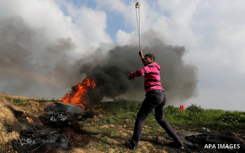Palestinian protesters clash with Israeli security forces as demonstrations continue over US President Donald Trump's declaration of Jerusalem as Israel's capital near the border with Israel in the southern Gaza Strip Fe...