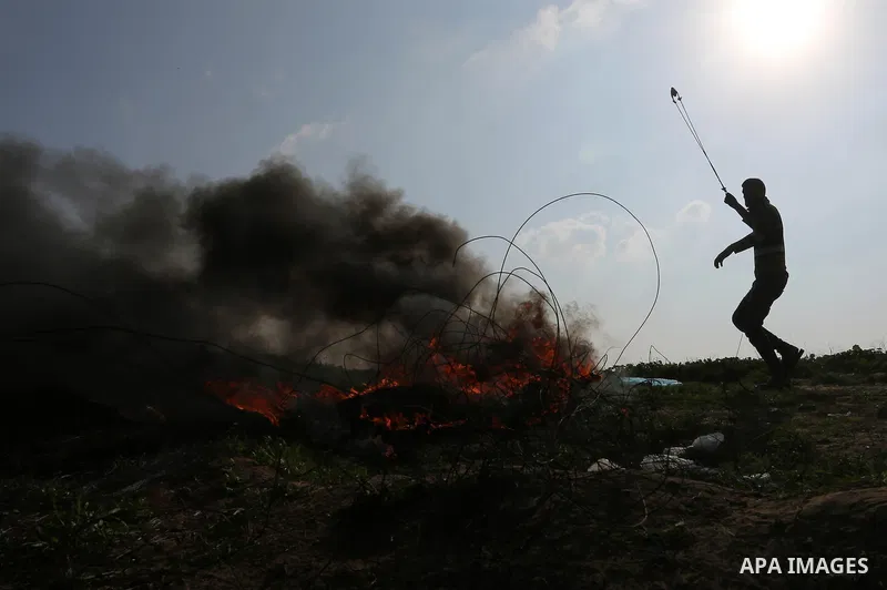Palestinian protesters clash with Israeli security forces as demonstrations continue over US President Donald Trump's declaration of Jerusalem as Israel's capital near the border with Israel in the southern Gaza Strip Fe...