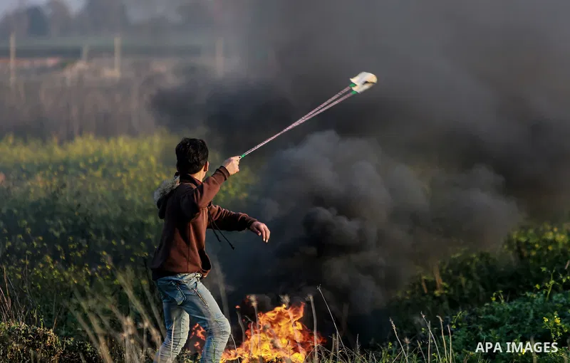 Palestinian protesters clash with Israeli security forces as demonstrations continue over US President Donald Trump's declaration of Jerusalem as Israel's capital near the border with Israel east of Gaza city February 16...