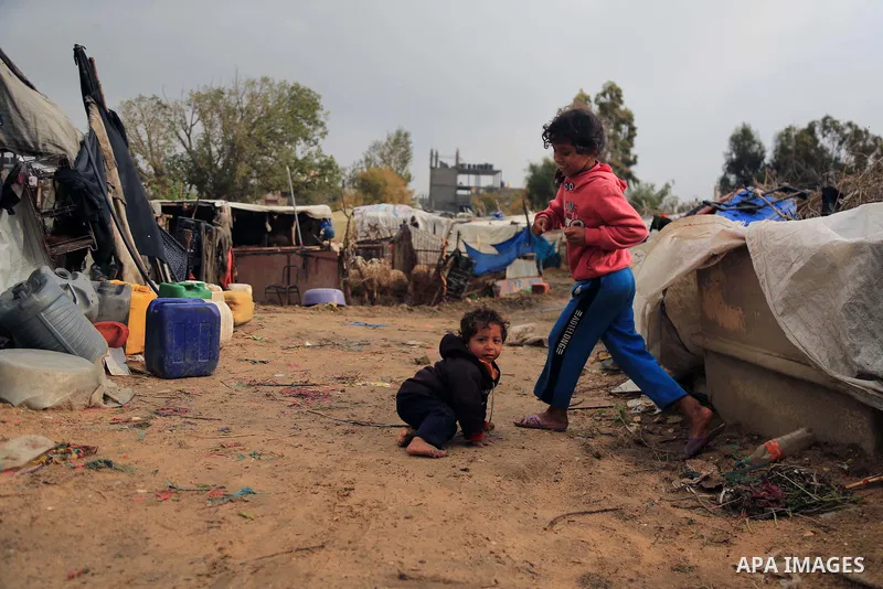 Palestinian children play outside of their family house in an impoverished area in Gaza City on February 18, 2018. Photo by Dawoud Abo Alkas