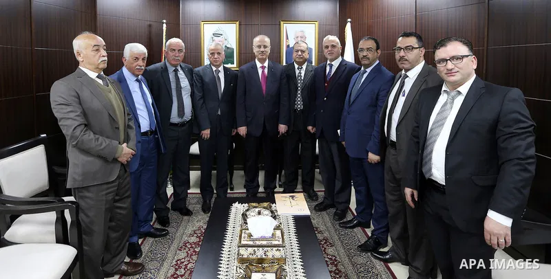 Palestinian Prime Minister, Rami Hamdallah, meets with chief justice, Imad Salim, in the West Bank city of Ramallah on February 18, 2018. Photo by Prime Minister Office