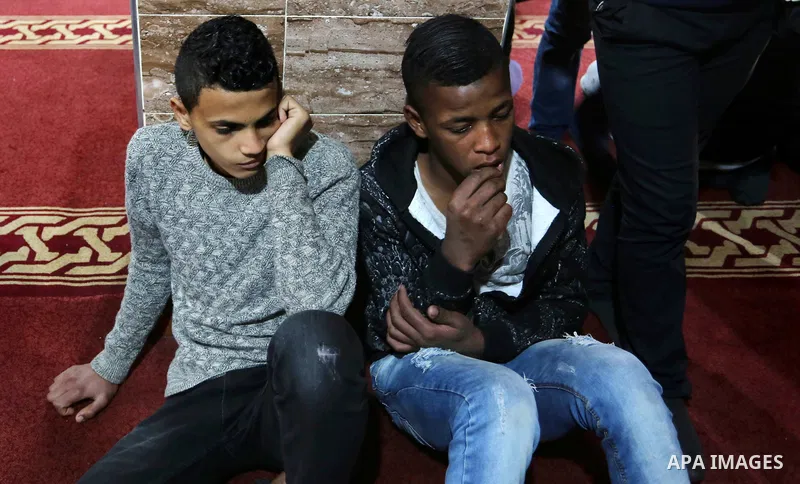 Relatives mourn during the funeral of two Palestinian teenagers, who were killed following Israeli air strikes, in Rafah in the southern Gaza Strip on February 18, 2018. Two Palestinians were killed by Israeli fire, Gaza...
