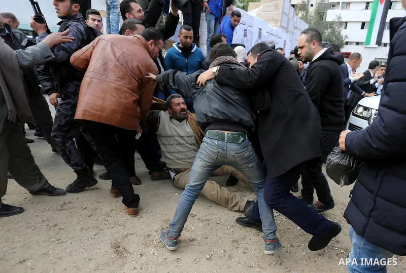 A Palestinian man reacts during the press conference of Qatar's Ambassador to the Palestinian Authority, Mohammed Al Emadi at al-Shifa hospital in Gaza city on February 19, 2018. Photo by Ashraf Amra