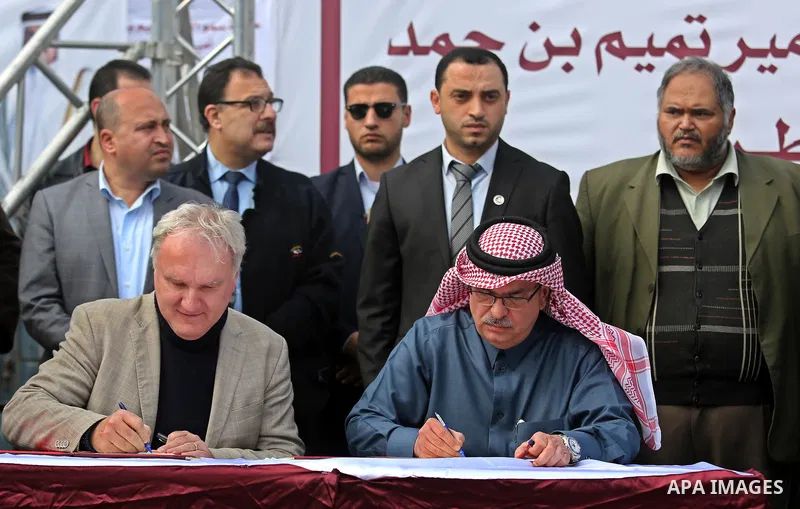 Qatar's Ambassador to the Palestinian Authority, Mohammed Al Emadi and Matthias Schmale, Director of United Nations Relief and Works Agency (UNRWA) Operations in Gaza sign an agreement of granting of Qatar's Emir Sheikh...