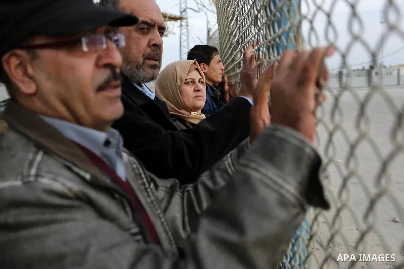 Palestinians wait for their relatives to return into Gaza after the Egyptian Authority opened the Rafah Border Crossing for one day, in the southern Gaza Strip February 19, 2018. Photo by Ashraf Amra