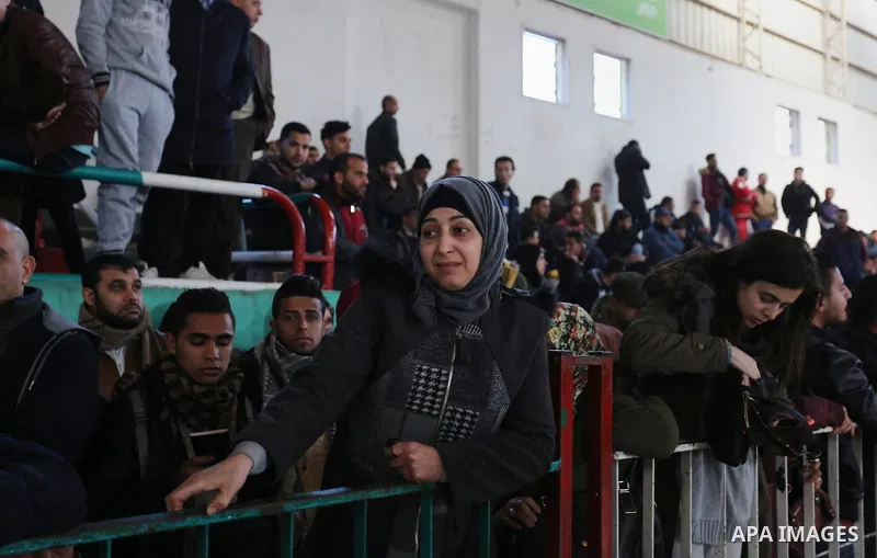 Palestinians wait for permission to cross into Egypt through the Rafah border crossing in the southern Gaza Strip after it was opened by Egyptian authorities on February 21, 2018. Both Israel and Egypt have maintained bl...