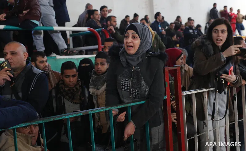 Palestinians wait for permission to cross into Egypt through the Rafah border crossing in the southern Gaza Strip after it was opened by Egyptian authorities on February 21, 2018. Both Israel and Egypt have maintained bl...