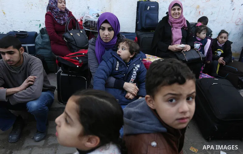 Palestinians wait for permission to cross into Egypt through the Rafah border crossing in the southern Gaza Strip after it was opened by Egyptian authorities on February 21, 2018. Both Israel and Egypt have maintained bl...