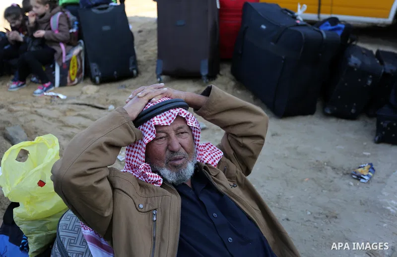 Palestinians wait for permission to cross into Egypt through the Rafah border crossing in the southern Gaza Strip after it was opened by Egyptian authorities on February 21, 2018. Both Israel and Egypt have maintained bl...