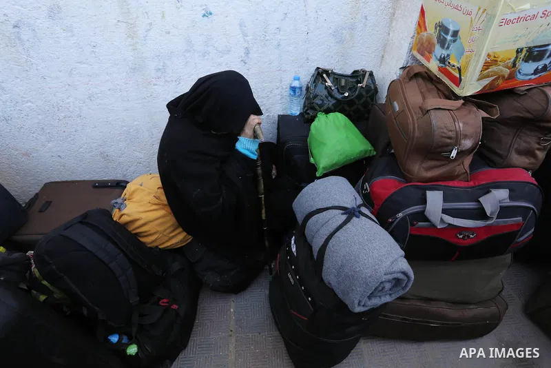 Palestinians wait for permission to cross into Egypt through the Rafah border crossing in the southern Gaza Strip after it was opened by Egyptian authorities on February 21, 2018. Both Israel and Egypt have maintained bl...