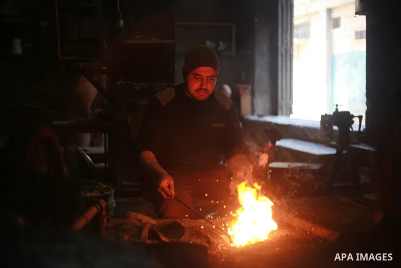 A Palestinian copper Ahmed Abdo, works at his father workshopt in Gaza city, on February 21, 2018. Abdo inherited copper profession from his father for nearly 40 years. Make replicas Crescent attached to mosques. He is t...