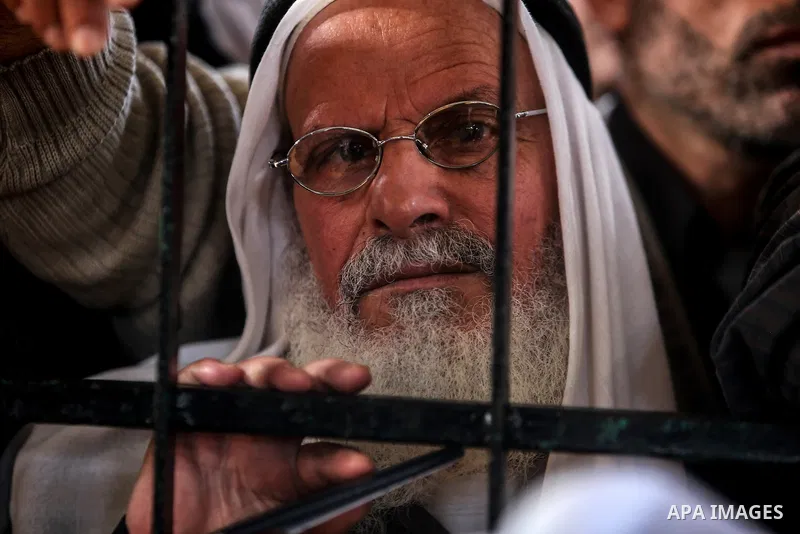 Palestinians wait for permission to cross into Egypt through the Rafah border crossing in the southern Gaza Strip after it was opened by Egyptian authorities on February 21, 2018. Both Israel and Egypt have maintained bl...
