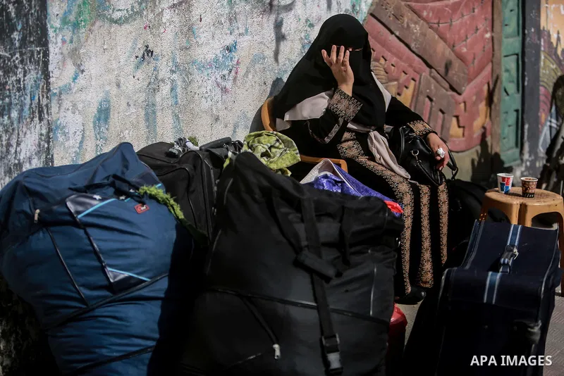 Palestinians wait for permission to cross into Egypt through the Rafah border crossing in the southern Gaza Strip after it was opened by Egyptian authorities on February 21, 2018. Both Israel and Egypt have maintained bl...