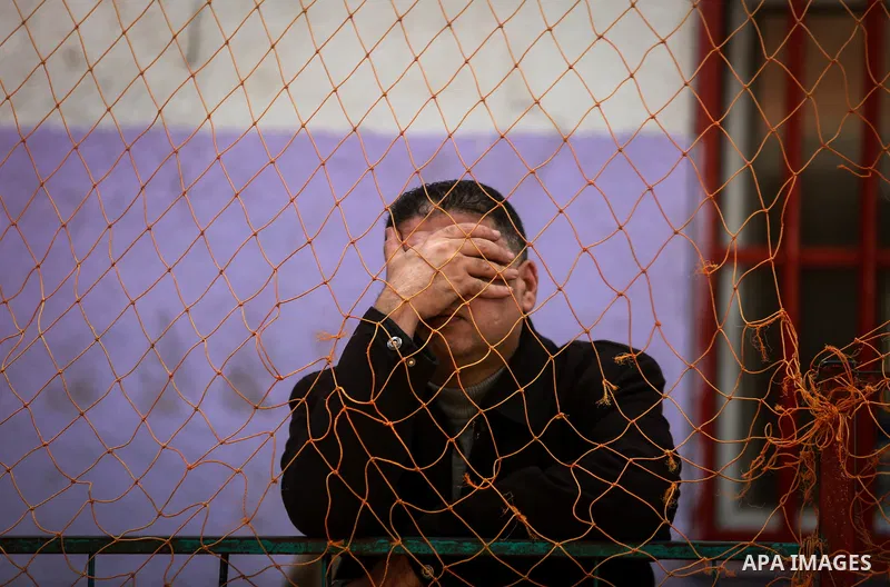 Palestinians wait for permission to cross into Egypt through the Rafah border crossing in the southern Gaza Strip after it was opened by Egyptian authorities on February 21, 2018. Both Israel and Egypt have maintained bl...