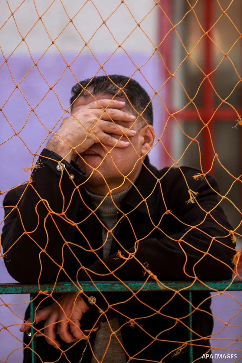 Palestinians wait for permission to cross into Egypt through the Rafah border crossing in the southern Gaza Strip after it was opened by Egyptian authorities on February 21, 2018. Both Israel and Egypt have maintained bl...