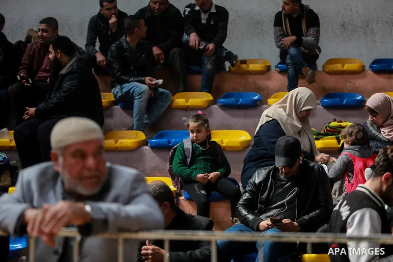 Palestinians wait for permission to cross into Egypt through the Rafah border crossing in the southern Gaza Strip after it was opened by Egyptian authorities on February 21, 2018. Both Israel and Egypt have maintained bl...