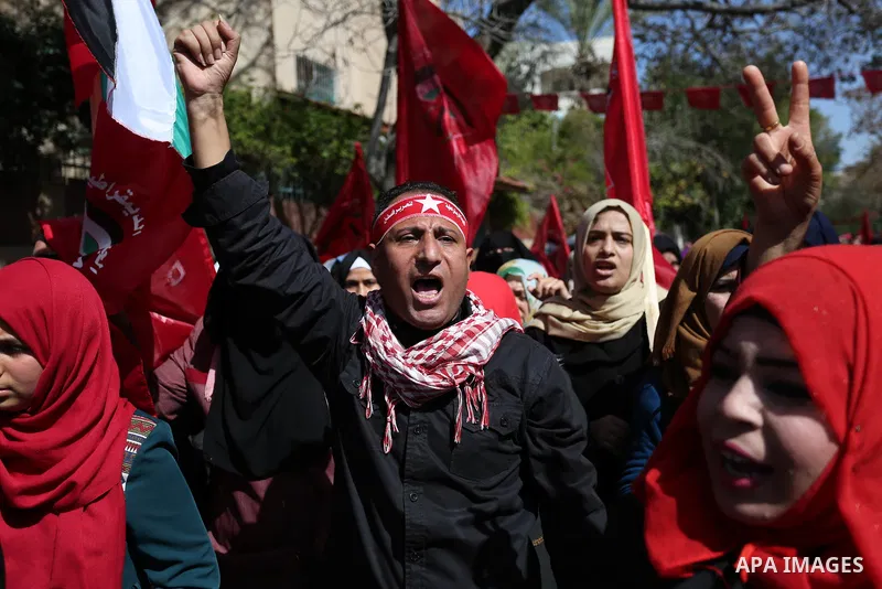 Palestinian supporters of the Democratic Front for the Liberation of Palestine (DFLP) take part in a rally marking the 49th anniversary of DFLP foundation in Gaza city on February 22, 2018. Photo by Ashraf Amra