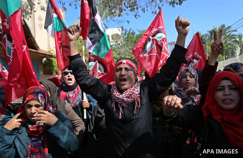Palestinian supporters of the Democratic Front for the Liberation of Palestine (DFLP) take part in a rally marking the 49th anniversary of DFLP foundation in Gaza city on February 22, 2018. Photo by Ashraf Amra