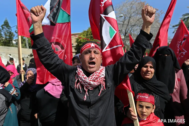 Palestinian supporters of the Democratic Front for the Liberation of Palestine (DFLP) take part in a rally marking the 49th anniversary of DFLP foundation in Gaza city on February 22, 2018. Photo by Ashraf Amra