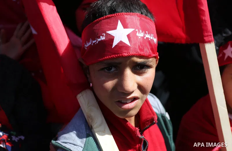 Palestinian supporters of the Democratic Front for the Liberation of Palestine (DFLP) take part in a rally marking the 49th anniversary of DFLP foundation in Gaza city on February 22, 2018. Photo by Ashraf Amra