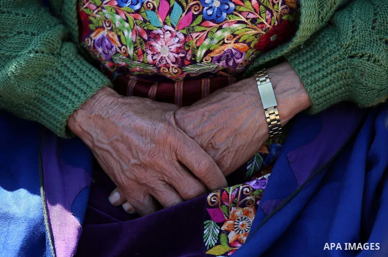 An elderly Palestinian woman Sobha Kassab 77, wears a traditional cloak or "Abaya" outside her house in the West Bank village of Qaryut, near Nablus on February 21, 2018. Decades ago, the cloack or "Abaya" was common for...