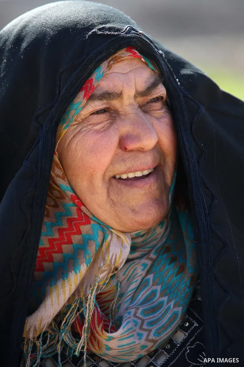 An elderly Palestinian woman Nada Auda 62, wears a traditional cloak or "Abaya" outside her house in the West Bank village of Qusra, near Nablus on February 21, 2018. Decades ago, the cloack or "Abaya" was common for vil...