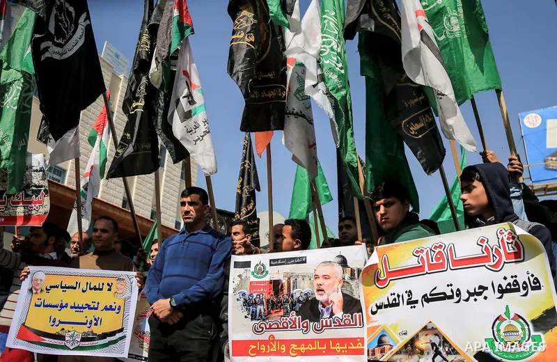 Palestinians take part during a protest against Trump's decision to recognize Jerusalem as the capital of Israel, in Jabalia in the northern Gaza Strip on February 23, 2018. US President Donald Trump has reiterated that...