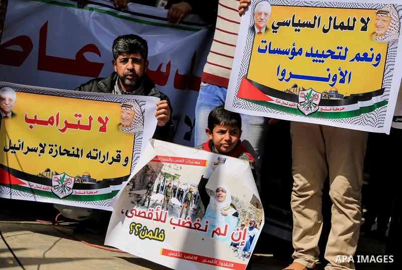 Palestinians take part during a protest against Trump's decision to recognize Jerusalem as the capital of Israel, in Jabalia in the northern Gaza Strip on February 23, 2018. US President Donald Trump has reiterated that...