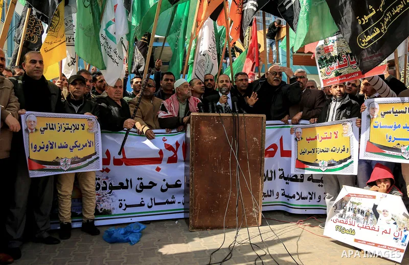 Palestinians take part during a protest against Trump's decision to recognize Jerusalem as the capital of Israel, in Jabalia in the northern Gaza Strip on February 23, 2018. US President Donald Trump has reiterated that...