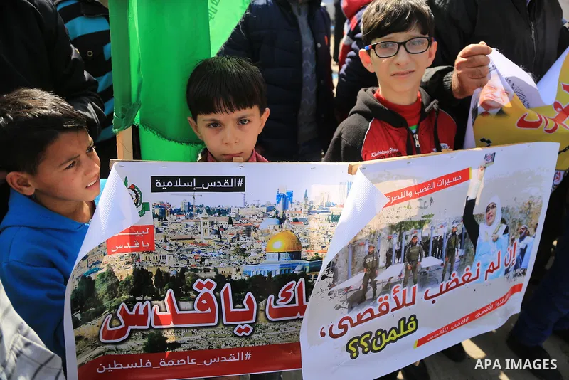 Palestinians take part during a protest against Trump's decision to recognize Jerusalem as the capital of Israel, in Jabalia in the northern Gaza Strip on February 23, 2018. US President Donald Trump has reiterated that...