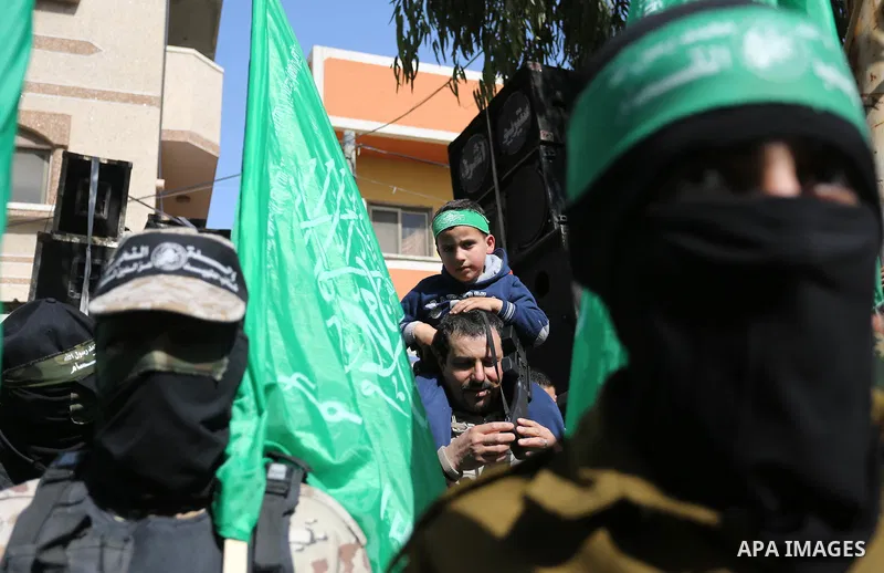 Palestinian supporters of Hamas movement take part in a protest against Trump's decision to recognize Jerusalem as the capital of Israel, at Nuseirat refugee camp, in the central of Gaza Strip on February 23, 2018. US Pr...