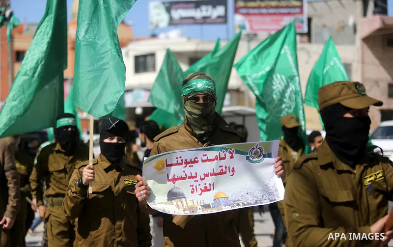 Palestinian supporters of Hamas movement take part in a protest against Trump's decision to recognize Jerusalem as the capital of Israel, at Nuseirat refugee camp, in the central of Gaza Strip on February 23, 2018. US Pr...