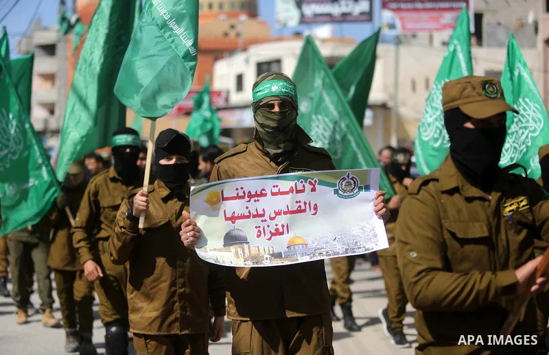 Palestinian supporters of Hamas movement take part in a protest against Trump's decision to recognize Jerusalem as the capital of Israel, at Nuseirat refugee camp, in the central of Gaza Strip on February 23, 2018. US Pr...