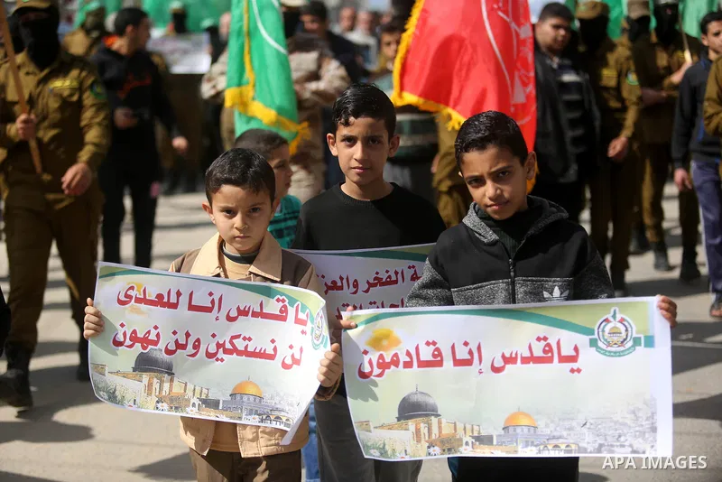 Palestinian supporters of Hamas movement take part in a protest against Trump's decision to recognize Jerusalem as the capital of Israel, at Nuseirat refugee camp, in the central of Gaza Strip on February 23, 2018. US Pr...