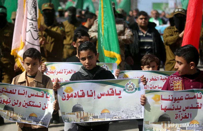 Palestinian supporters of Hamas movement take part in a protest against Trump's decision to recognize Jerusalem as the capital of Israel, at Nuseirat refugee camp, in the central of Gaza Strip on February 23, 2018. US Pr...