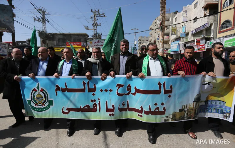 Palestinian supporters of Hamas movement take part in a protest against Trump's decision to recognize Jerusalem as the capital of Israel, at Nuseirat refugee camp, in the central of Gaza Strip on February 23, 2018. US Pr...