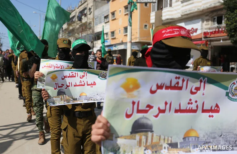 Palestinian supporters of Hamas movement take part in a protest against Trump's decision to recognize Jerusalem as the capital of Israel, at Nuseirat refugee camp, in the central of Gaza Strip on February 23, 2018. US Pr...