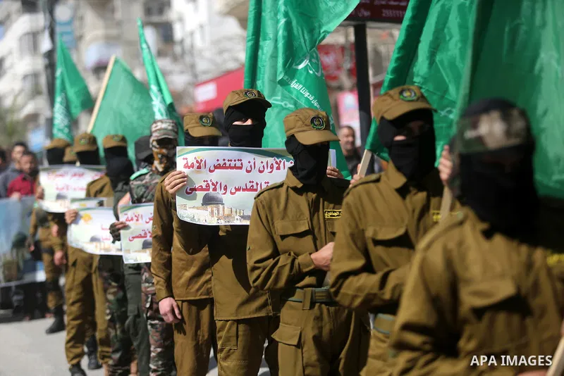 Palestinian supporters of Hamas movement take part in a protest against Trump's decision to recognize Jerusalem as the capital of Israel, at Nuseirat refugee camp, in the central of Gaza Strip on February 23, 2018. US Pr...