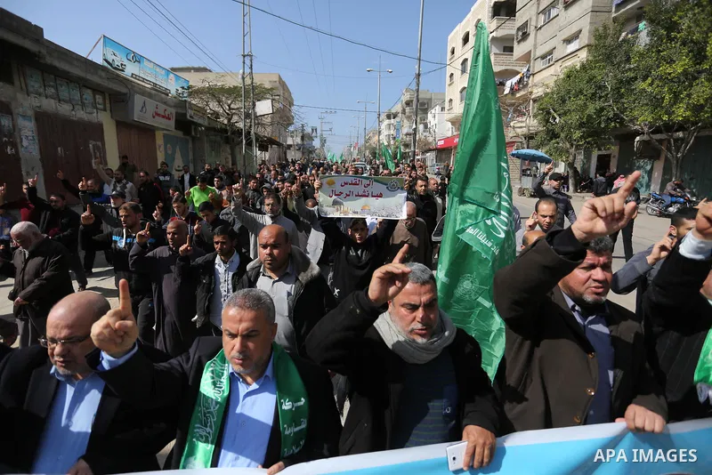 Palestinian supporters of Hamas movement take part in a protest against Trump's decision to recognize Jerusalem as the capital of Israel, at Nuseirat refugee camp, in the central of Gaza Strip on February 23, 2018. US Pr...
