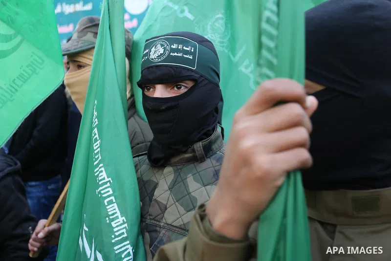 Palestinian supporters of Hamas movement take part in a protest against Trump's decision to recognize Jerusalem as the capital of Israel, at Nuseirat refugee camp, in the central of Gaza Strip on February 23, 2018. US Pr...