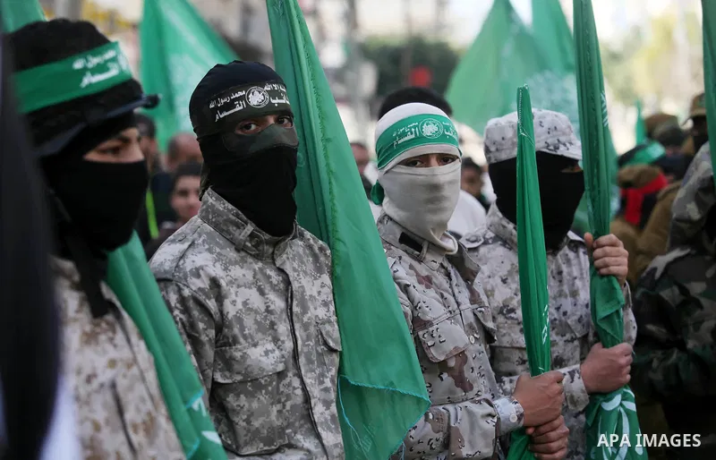 Palestinian supporters of Hamas movement take part in a protest against Trump's decision to recognize Jerusalem as the capital of Israel, at Nuseirat refugee camp, in the central of Gaza Strip on February 23, 2018. US Pr...