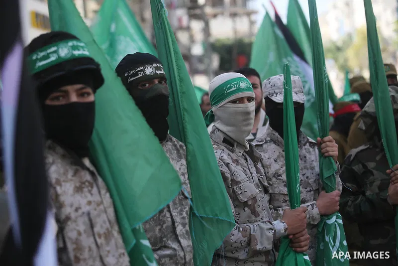 Palestinian supporters of Hamas movement take part in a protest against Trump's decision to recognize Jerusalem as the capital of Israel, at Nuseirat refugee camp, in the central of Gaza Strip on February 23, 2018. US Pr...
